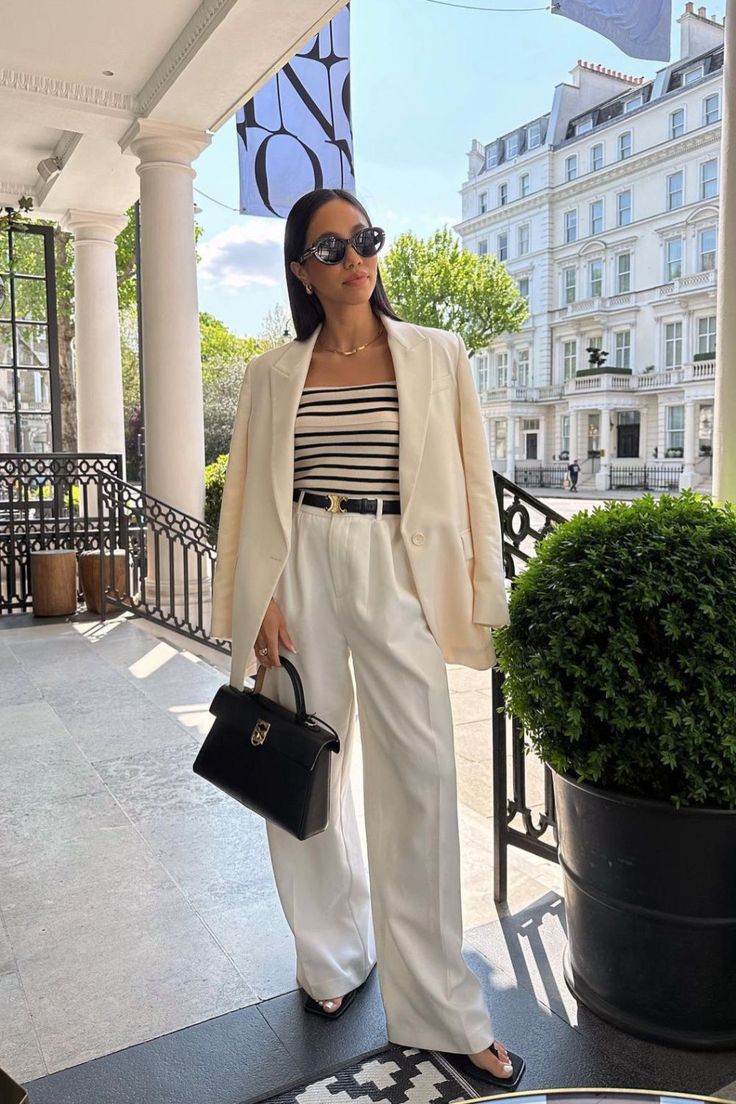 A woman in an Grammar NYC suit