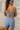 Recycled polyester shorts combine London style with sustainable design for ethical fashion.