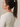 fast fashion sustainability, fashion and sustainability, white workout top, long sleeve top sustainable activewear, made from recycled fishing nets, recycled materials, environmentally friendly clothing companies, womens ethical clothing, recycled clothing brands