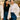 Mother & daughter wear matching white overshirts & blue adjustable waist jeans, smiling outdoors.