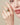 Gold heart statement ring worn on finger