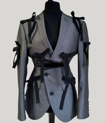 Upcycled grey with bows blazer set, transformed from a men's blazer into a cropped jacket and high waisted mini skirt.