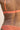 Dos d'un soutien-gorge de couleur terracotta en dentelle recyclée.