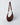 A dark brown crescent-shaped shoulder bag made of suede or faux suede, featuring a matching adjustable shoulder strap with gold-tone hardware, set against a light gray studio background.#color_chocolate-suede