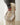 a woman in a grey sweater and cream pants holds a HYER GOODS convertible python crossbody hobo crescent bag Piccola ring bag #color_python-no-2