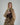 a woman wears a cream sweater turtleneck and a belted, oversized khaki trench coat with a brown suede crescent shoulder bag #color_chocolate-suede