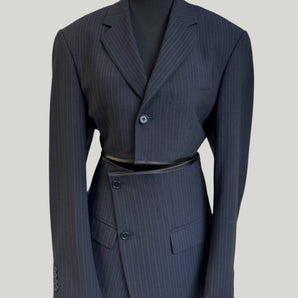 Upcycled pinstripe blazer set, transformed from a men's blazer into a cropped jacket and mini skirt.