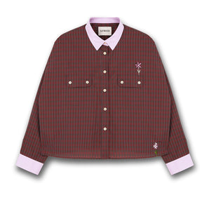 Womens mini red check shirt with a boxy silhouette. Jules Shirt from Saywood with embroidered flower detail, utility style pockets, and lilac contrasting collar and cuffs.