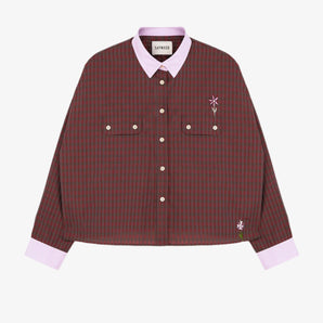 Womens mini red check shirt with a boxy silhouette. Jules Shirt from Saywood with embroidered flower detail, utility style pockets, and lilac contrasting collar and cuffs.