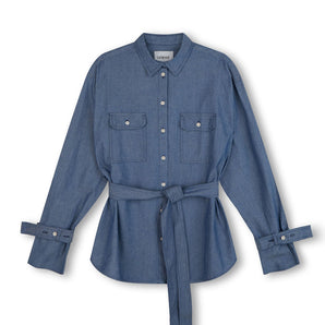 Womens Oversized Shirt Denim. Zadie Boyfriend Fit Shirt in Japanese Denim, light mid wash, with safari styling details, utility patch pockets, with a detachable tie belt and sleeve cuff details, by Saywood.