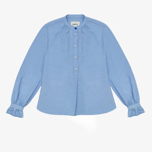 Womens Pale Blue Blouse, A-line shape with Gathered Neck and Frill cuffs. Marie Blouse by Saywood in pale blue recycled cotton. Vintage glass button at neck of the limited edition version.