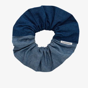 Patchwork scrunchie, made in mid wash and light wash Japanese denim. A Saywood label is stitched into the seam.