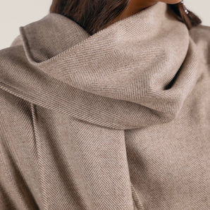 Beige wool blent coat with scarf-effect neckline and belt.